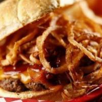 Cowtown · Cheddar cheese, cattleman’s bbq sauce, bacon and topped with fried shoestring onions.