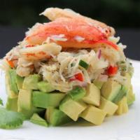 Avocado Crab Tower Bowl · Crabmeat, avocado, mango sauce, eel sauce, furikake, and shrimp cracker.