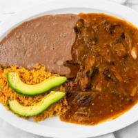 Bistek Ranchero · Chopped beef skirt in ranchero sauce. Accompanied with rice, refried beans and avocado.