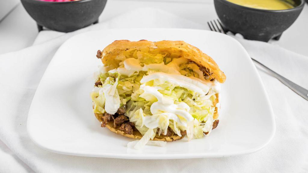 Gorditas · Fried corn tortilla, fried beans, cheese, lettuce, sour cream and your choice of meat.