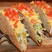 Crunchy Tacos · Crunchy tacos with your choice of ground beef or shredded chicken with lettuce, tomatoes and...
