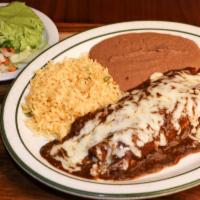 Mole Enchiladas · Two mole enchiladas filled with shredded chicken served with rice and beans.