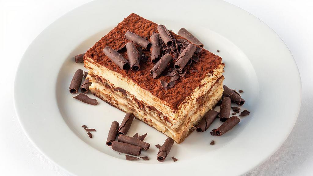 Tiramisu · Traditional lady fingers dipped in coffee and brandy layered with sweetened mascarpone finished with cocoa powder.