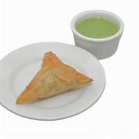 Beef Samosa · Ground beef and cabbage in a crispy triangular pastry.