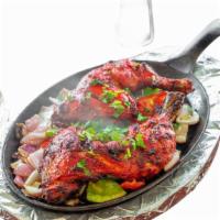 Chicken Tandoori · Leg quarter marinated in spices and yogurt baked in clay oven.