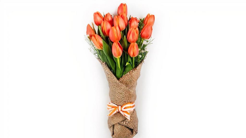  Tulip In Burlap Wrap · Tulips wrapped in burlap. Base price is for ten tulips, You can add up to 40 more tulips in the same wrap. Picture shows 15 tulips total. Fresh cut tulips color is based on available inventory on the day you place your order. Please specify  preferred color and one alternative color in special instructions and we will try our best to make it within those colors.