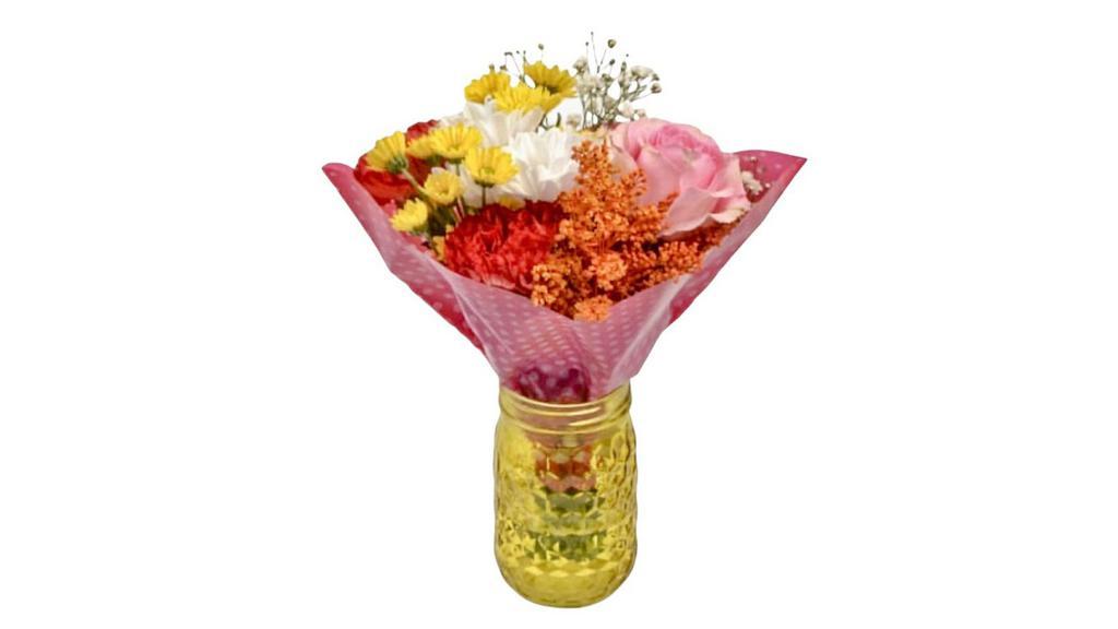 Floral Arrangement In A Jar · Various selection of floral arrangements in a colored jar