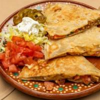 Quesadillas · Ten inches flour or corn tortilla stuffed with mozzarella cheese cilantro, onions, and your ...