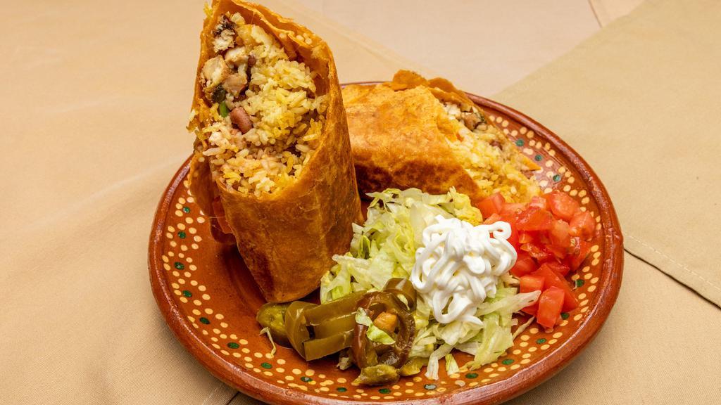 Burritos · Rice, beans, cheese lettuce, tomatoes, and your choice of meat.