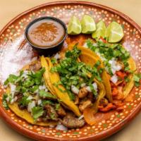 Tacos · Corn or flour comes with cilantro and onions.