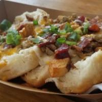 The Johnny Hash · Biscuits, gravy, sausage, thick sliced peppered maple bacon, home fries, colby jack cheese a...