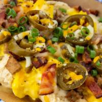 The Gloria Gaynor · Biscuits, gravy, three scrambled eggs, sausage, jalapenos, thick sliced peppered maple bacon...