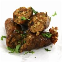 Boudin Links · Links filled with cajun rice and pork meat
