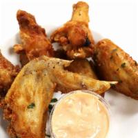 Famous Wings · Delicious crispy seasoned house wings loaded with flavor