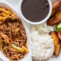 Ropa Vieja · Shredded brisket with sofrito, fresh tomatoes and lettuce.
