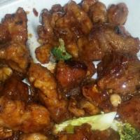 Orange Chicken, Pork, Or Tofu · Choice of chicken, pork, or tofu and broccoli, lightly breaded in lotus flour, deep-fried an...