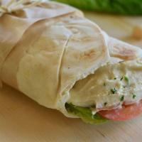*Signature Hummus Wrap · Included Toppings: Hummus, Pickles, Mediterranean Salad, Green Chili Sauce, Pita bread.