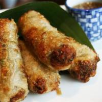 Fried Imperial Rolls · Four fried rice paper rolls filled with ground pork, diced shrimp and fresh herbs mix is sea...