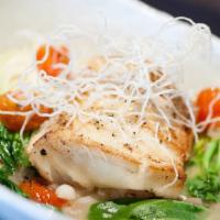 Chilean Sea Bass · 7 oz. filet and poached in garlic- lemongrass white wine broth with baby bok choy and rice n...