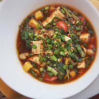 Sweet & Sour Vegetable Soup · Hearty tomato and pineapple broth, filled with crushed peanuts, fresh local tofu, spinach an...
