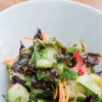 Cucumber Salad · Green side-salad with cucumber ribbons, mixed greens and ginger tossed with bell peppers, sh...