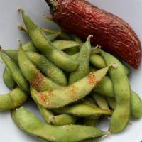 Steamed Spicy Edamame · Steamed and tossed in a spicy seasoning blend served with blistered red jalapeño.