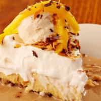 Coconut Cream Pie · Scratch pie layered with a coconut macaroon crust, coconut custard and fresh meringue. Serve...