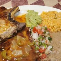 #8 Pork Chop · 2 Eggs any style, 1 Pork Chop topped with Salsa Ranchera, served with Potatoes and Refried B...