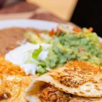#37 Quesadilla Dinner · Beef or Chicken, Pico de Gallo, Sour Cream, Guacamole, served with Rice and Refried Beans.