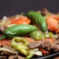 #24 Fajita Plate · Beef or Chicken Fajitas served with Grilled Onions, Tomatoes, Bell Peppers, Pico de Gallo, G...