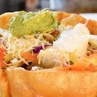 #28 Taco Salad · Tortilla Shell filled w/Beef or Chicken, Lettuce, Tomato, Sour Cream, Guacamole and Cheese. ...