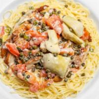 Chicken Piccata · Breaded chicken topped with artichoke hearts, diced tomatoes, chives and capers, in a lemon ...