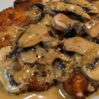 Chicken Marsala · Breaded chicken with mushrooms and our creamy marsala sauce, served with garlic mashed potat...