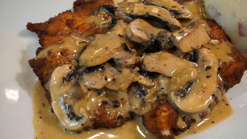 Chicken Marsala · Breaded chicken with mushrooms and our creamy marsala sauce, served with garlic mashed potatoes.