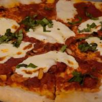 Margherita · Fresco sauce, mozzarella, fresh basil, and evoo.