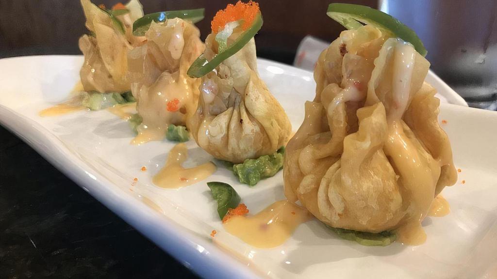 Spicy Lobster Dumpling ** · Guacemole Topped with lobster dumpling, jalapeño, masago and sweet spicy sauce.