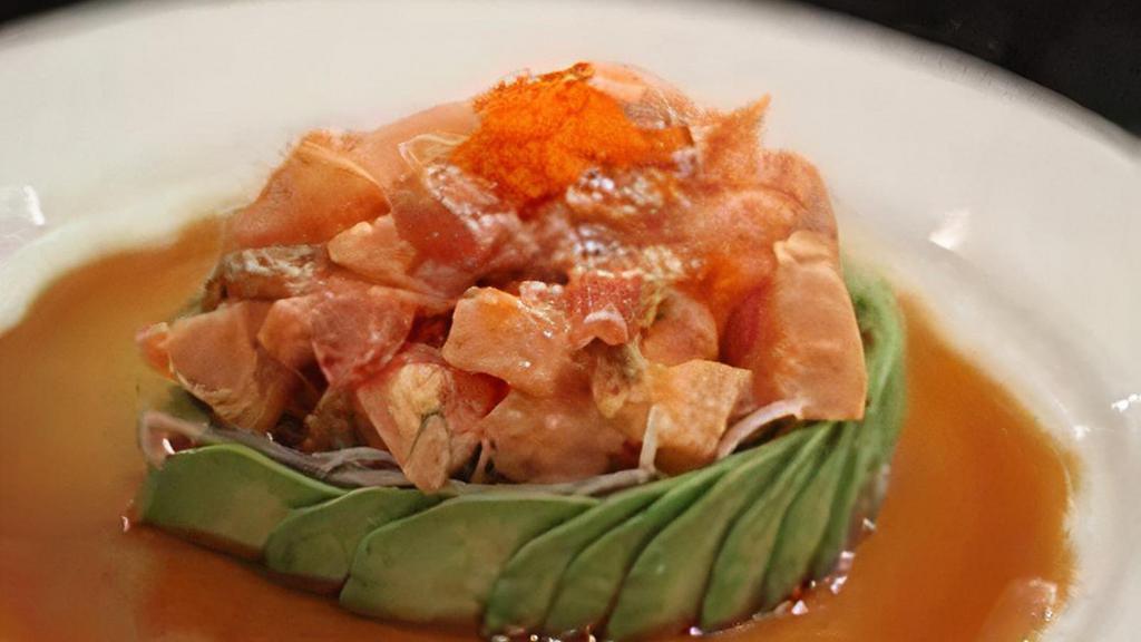 Treasure Island ** · Spicy mixed tuna, yellowtail, salmon and escolar surrounded by avocado and ponzu sauce