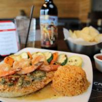 Tilapia Al Blanco · Pan seared tilapia topped with a velvety white butter wine sauce served with three sautèed s...