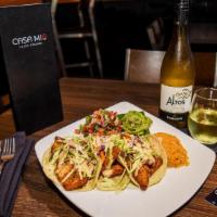Fish Tacos · Three corn tilapia tacos served with cabbage and Casa Mia sauce