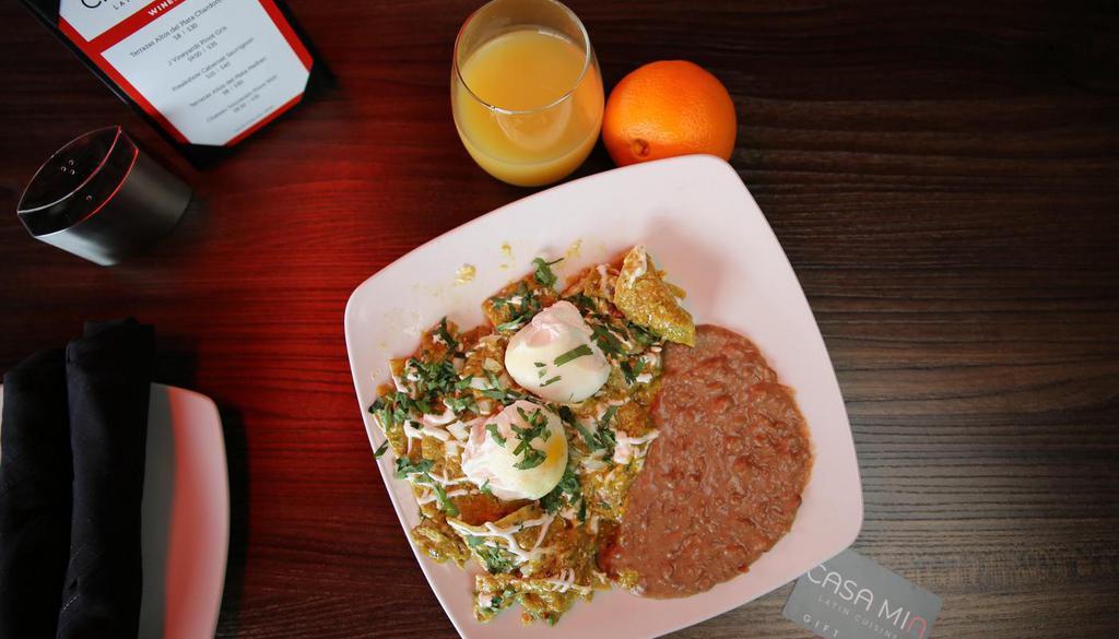Chilaquiles · Two poached eggs with cilantro, onions, and crispy tortilla strips. Topped with salsa verde and sour cream