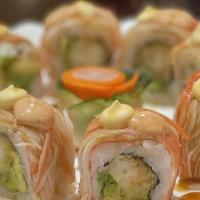 Shaggy Dog Roll · Shrimp tempura inside. Topped with crab, mayo, spicy mayo, and eel sauce.