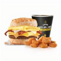 Monster Biscuit (Medium Combo) · Crispy bacon, sausage patty, two folded eggs, Swiss & American cheeses on a�buttermilk biscu...