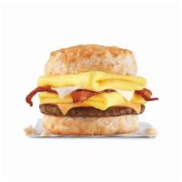 Monster Biscuit · Crispy bacon, sausage patty, two folded eggs, Swiss & American cheeses on a�buttermilk biscu...