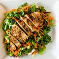 Grilled Chicken Salad · Grilled chicken on a bed of fresh vegetables.