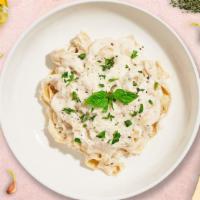Carbonara (Fettuccine) · Classic Italian pasta dish made with mushrooms, ham, and black olives.