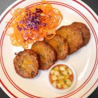 Fish Cake · 5 pieces. A combination of spicy red curry with fish paste, served with sweet and sour cucum...