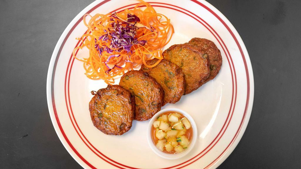 Fish Cake · 5 pieces. A combination of spicy red curry with fish paste, served with sweet and sour cucumber sauce.