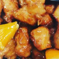 Orange Chicken · Crispy chicken, flavored with orange sauce served with steamed broccoli and carrots.