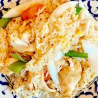Thai Fried Rice · Steamed rice stir-fried with eggs, onions, and tomatoes.
