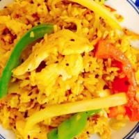 Curry Fried Rice · Steamed rice stir-fried with bell peppers, eggs, onions and yellow curry powder.
